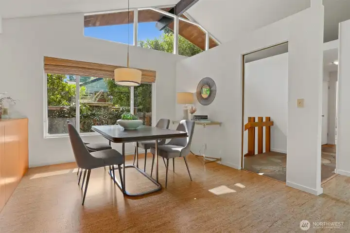Designer lighting casts a golden glow over the dining area.