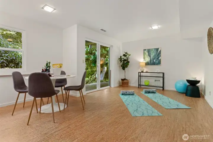 A true flex space, perfect for game night, fitness, crafting and hobbies.  Daylight access to the yard and back patio.