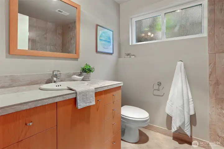 Lovely remodel of the lower-level bathroom.