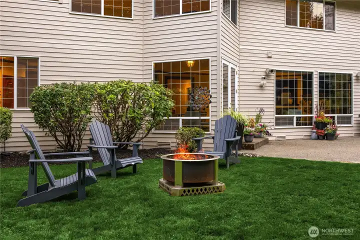 The quiet, park-like backyard backs to private green space and features a large patio and Breeo smokeless fire pit for nights under the stars.