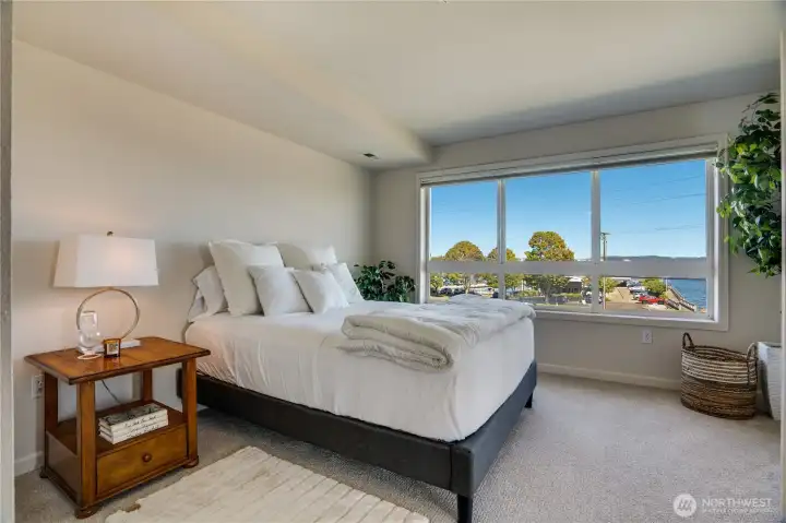 Wake up to incredible views from the large, bright windows in the freshly updated primary bedroom.