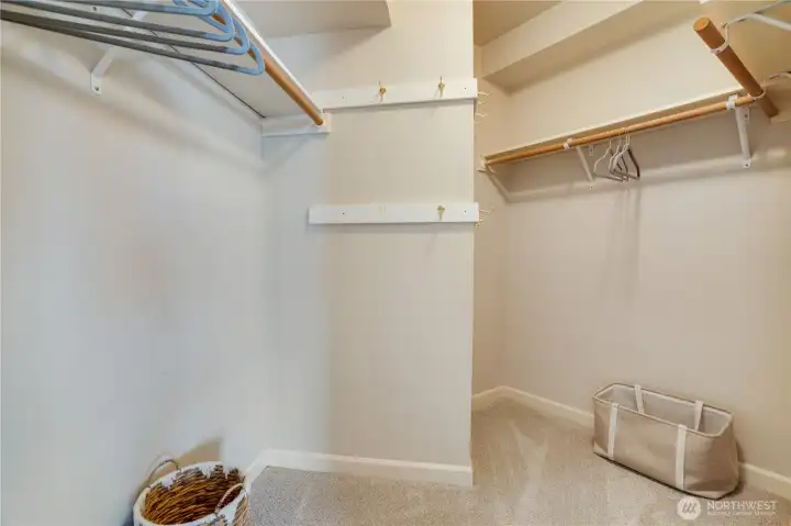 The XL walk-in closet offers plenty of room for hanging clothes, shoes, and seasonal storage.