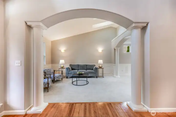 Formal living room with vaulted ceilings & skylights