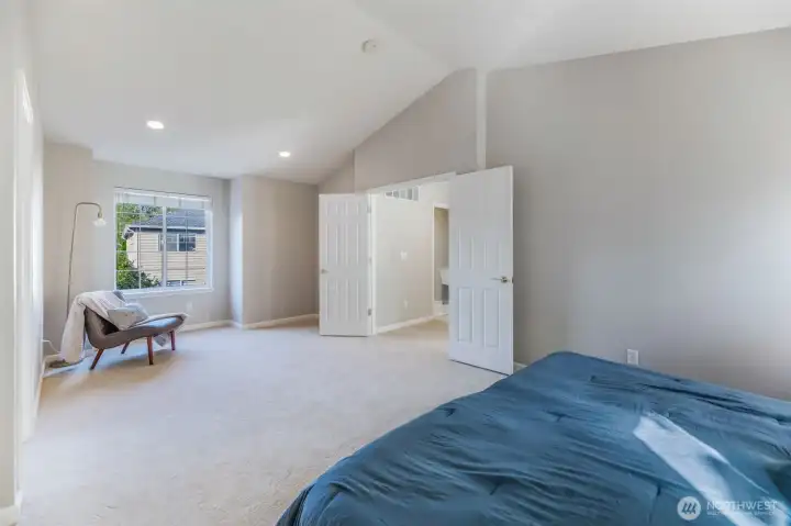 Tons of natural light and vaulted ceilings in the primary bedroom