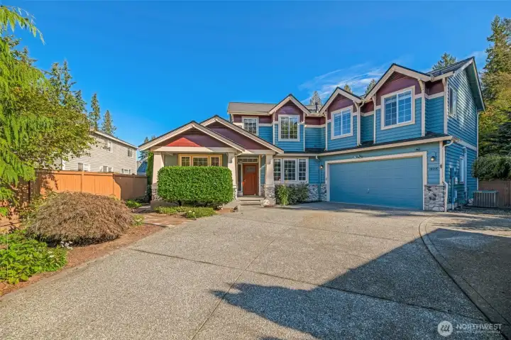 2 cars fit easily in the garage, plus plenty of room for more in the driveway