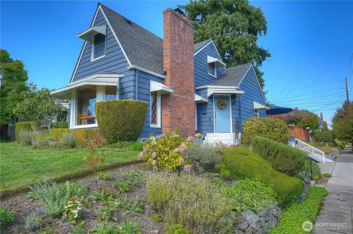 Look at those lines- so much fabulous architectural detailing in this picture perfect home perched on a large corner lot.