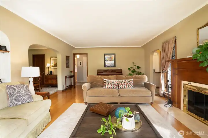 To the right is the entrance, straight ahead is the hallway taking you to two bedrooms and a full bath.  The arch on the left takes you to your formal dining area.