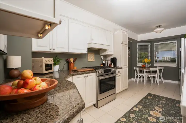 The kitchen is often the heart of the home and this one is no different. Simple, understated, charming, and functional.  What a fab combo. And, the eating area, with natural light, is a wonderful place for a morning cup of joe or an informal meal.