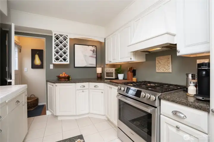 An oversized Bosch gas range and stove makes cooking, even for crowds, a breeze.  Door leads to the lower level, but we're going to continue to the rest of the main floor.  Fabulous lower level to be continued.