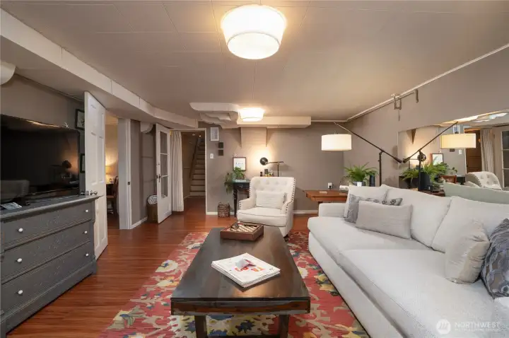 To the left of the living room is a sleep suite, dining room, kitchen, and 3/4 bath.  We saw those, now let's head back upstairs and visit the top floor.