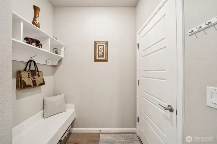 Mudroom with bench off garage