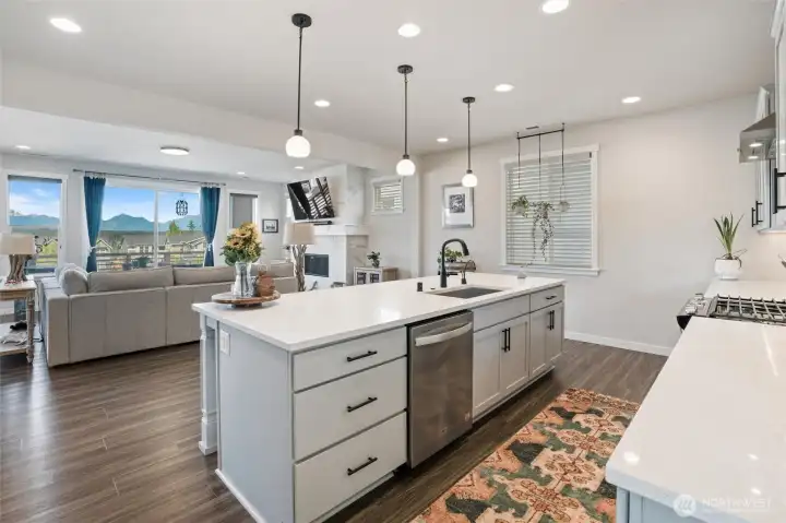 Gas stove, window to back yard, wine nook, coffee nook on either side of fridge.