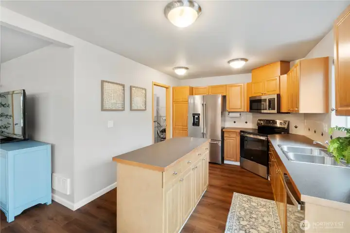 Large kitchen with stand alone island and plenty of storage.