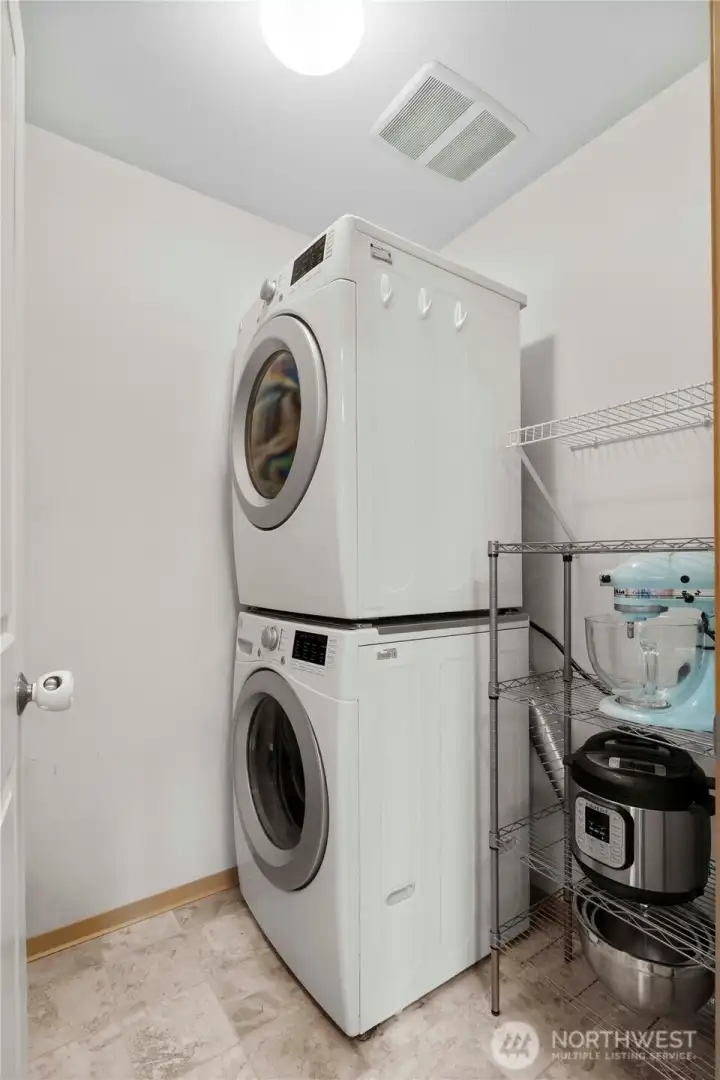 Utility room on main floor with extra storage space.