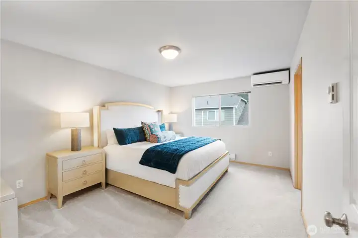 Huge primary suite with attached bath and walk-in closet area.
