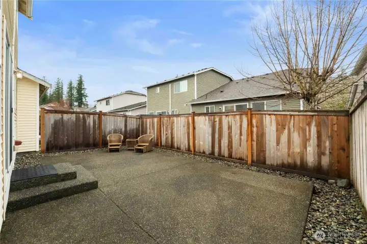 Nice size fenced backyard patio.