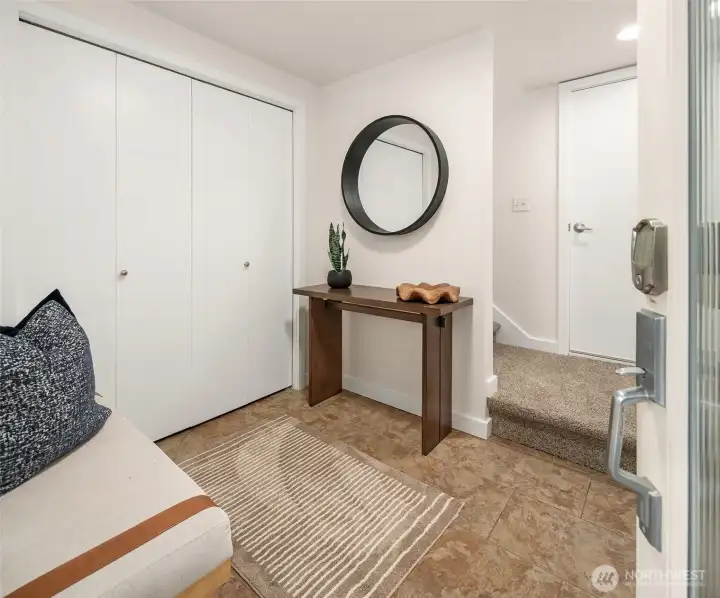 Large entryway with utility closet