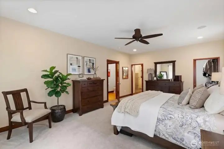 Primary suite on MAIN floor features a walk-in closet and full bathroom.