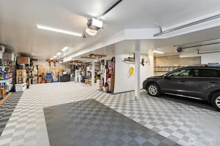 Check out this amazing 1796 sqft garage: special feature is the SwissTrax flooring system. Plenty of room for 3+cars, a boat or whatever toys you want to store.
