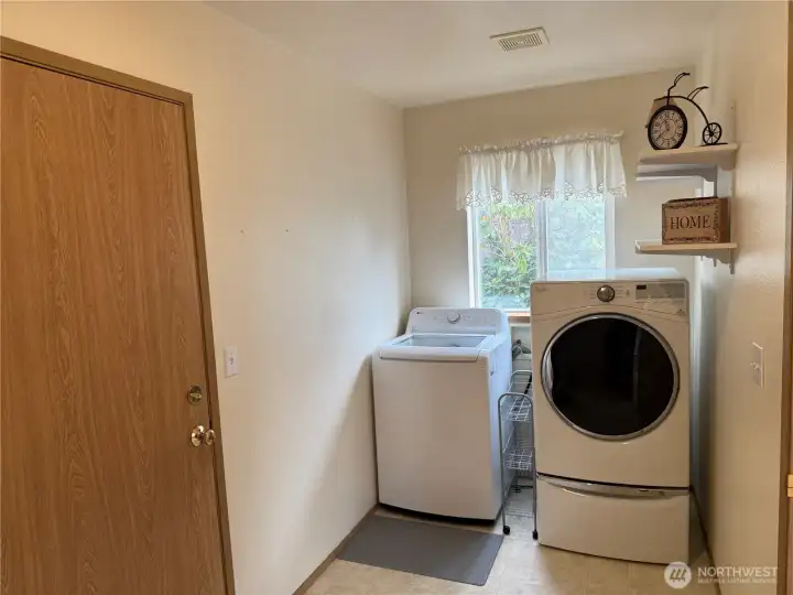 Spacious Laundry Room conveniently located between the Family Room and 2 Car Garage.