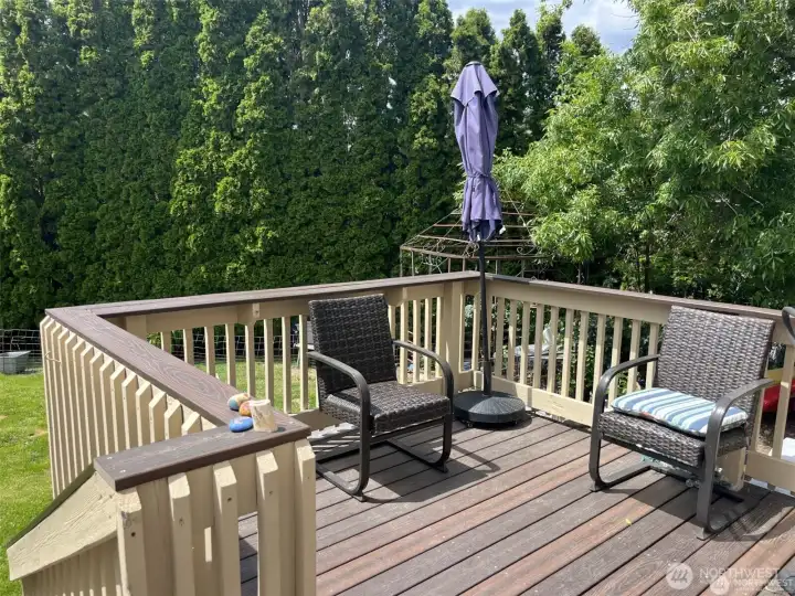 Deck overlooking the private backyard.