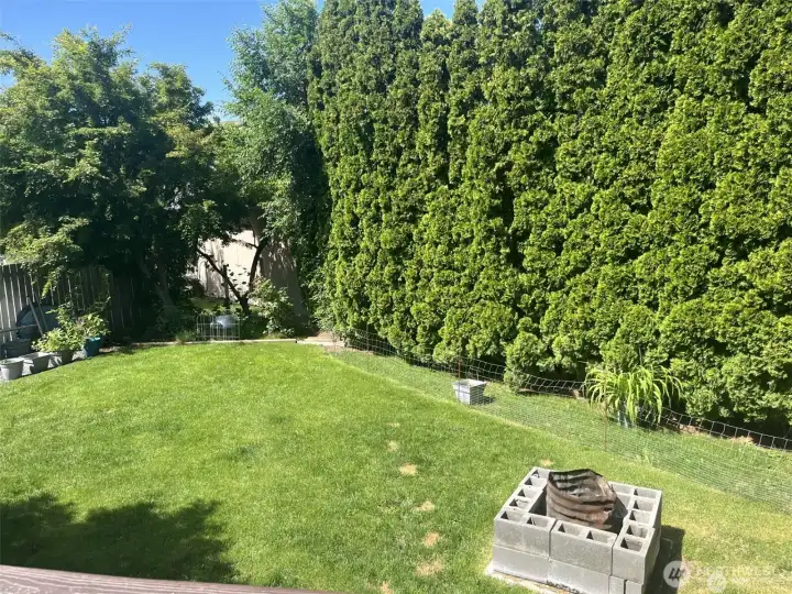Very private back yard, parially fenced.