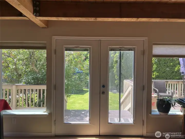 French doors leading from the living room to the back deck and yard.