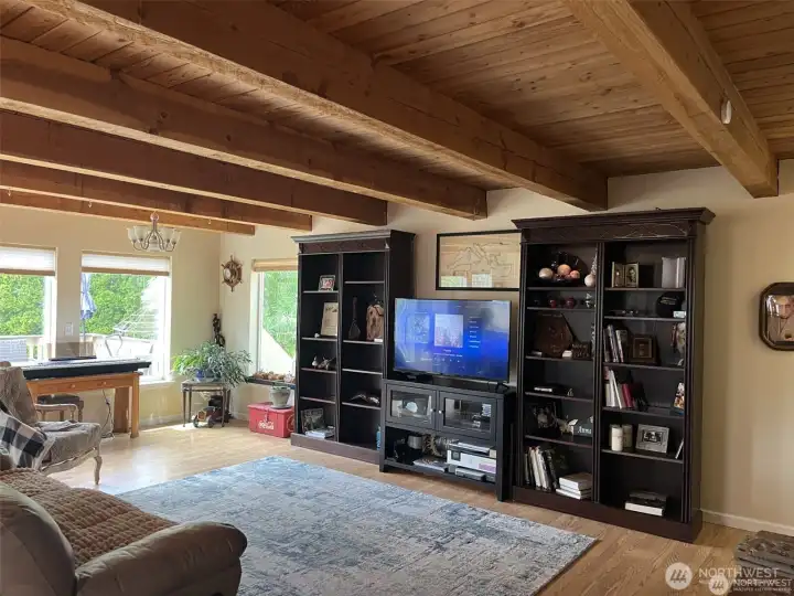 Exposed beams throughout the first level of the home. Large living space.