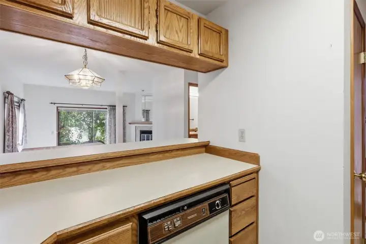 Kitchen has open access into dining are with bar seating.