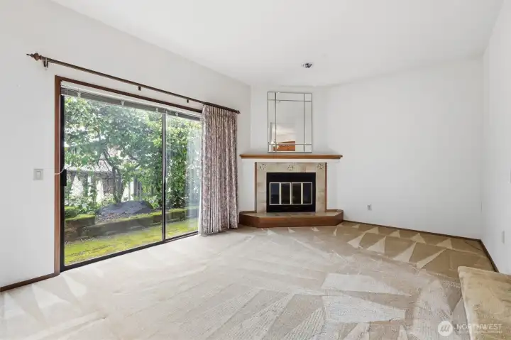Living room has large sliding glass door with patio access.