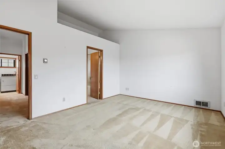 Primary bedroom has access to bathroom through door on right.