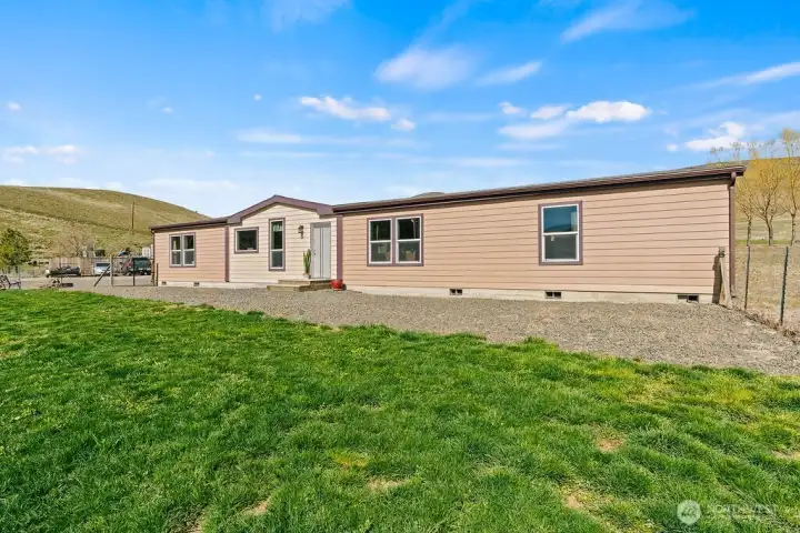 Enjoy the balance of usable green space and low-maintenance landscaping, perfect for outdoor living, pets, or simply relaxing in a quiet setting.