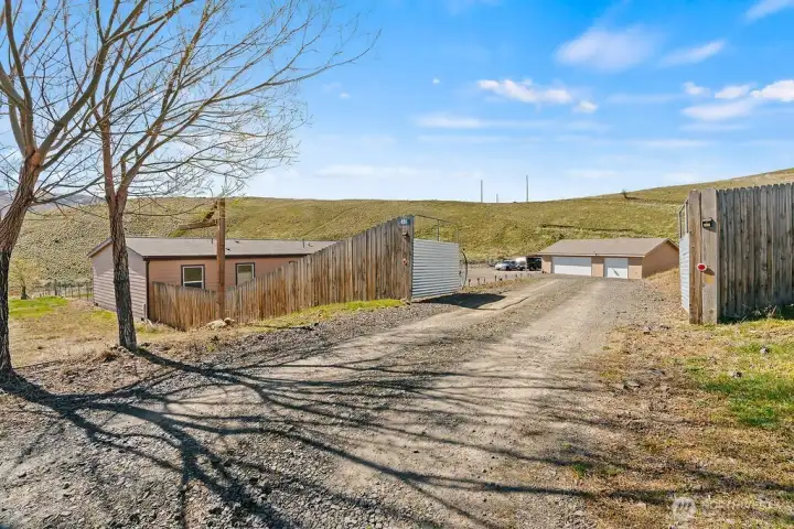 Private gated entry welcomes you into nearly 4 acres of peaceful Wenas Valley living, offering a sense of arrival, privacy, and space right from the start.