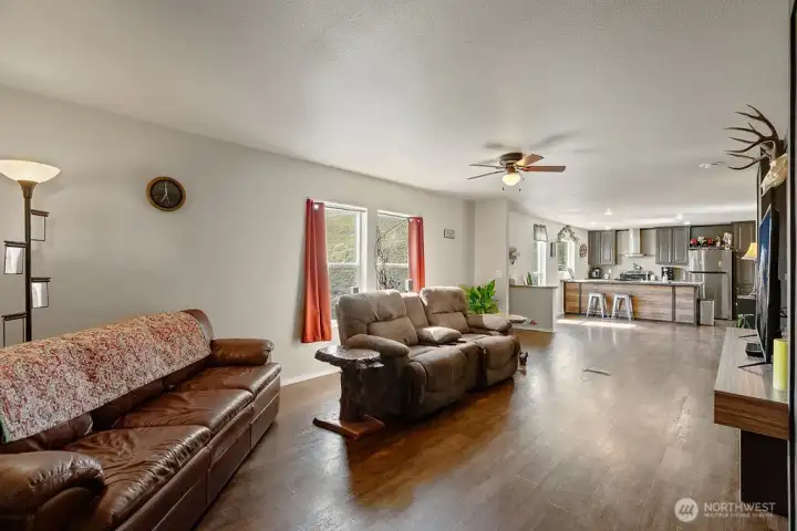 Wide-open living space flowing into the kitchen, offering flexibility for furniture placement and everyday comfort.
