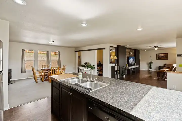 Open sightlines from the kitchen into the main living spaces, allowing for connection and visibility throughout the home.