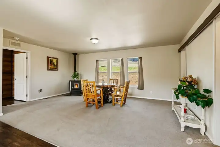 Spacious open living and dining area with plenty of room to configure your ideal layout—perfect for everyday living or hosting gatherings.