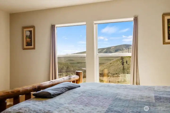 Wake up to scenic valley views right from your bed—large windows frame the surrounding landscape and bring the outdoors in.