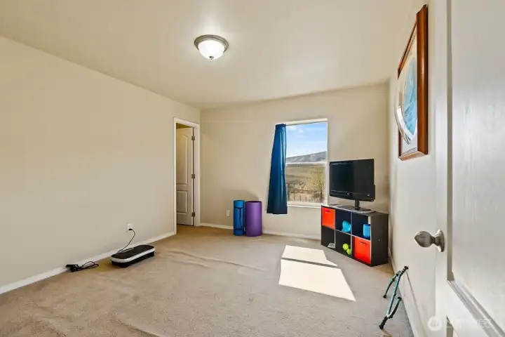 Versatile third bedroom that can easily function as a home office, workout space, or hobby room to fit your lifestyle.