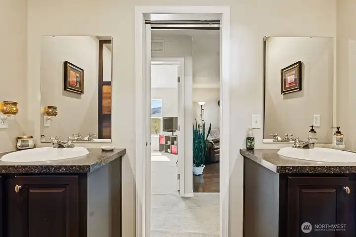 Bathroom with dual vanities providing added space and convenience, ideal for shared use.