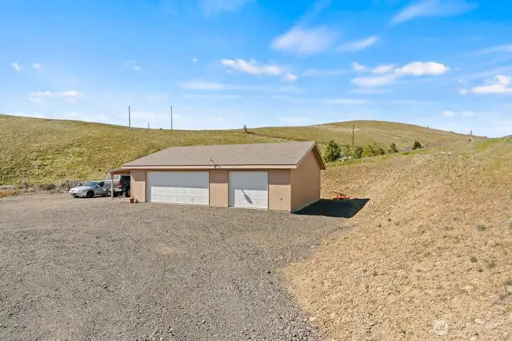 Large detached shop with multiple bays and 220 power provides the perfect setup for hobbies, storage, projects, or recreational vehicles.