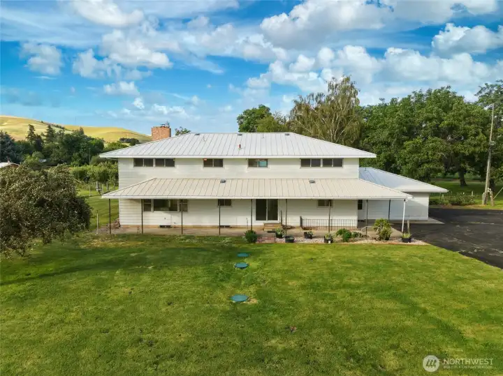 Two-Story Home with Metal Roof and Metal Siding