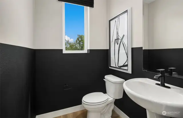 Powder room on the main floor. Discreetly located for privacy.