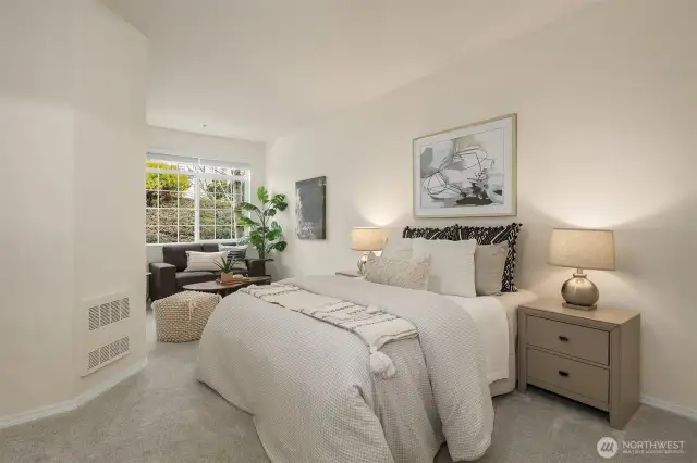 The primary bedroom is exceptionally large with an adjacent sitting area (or work-from-home space?).