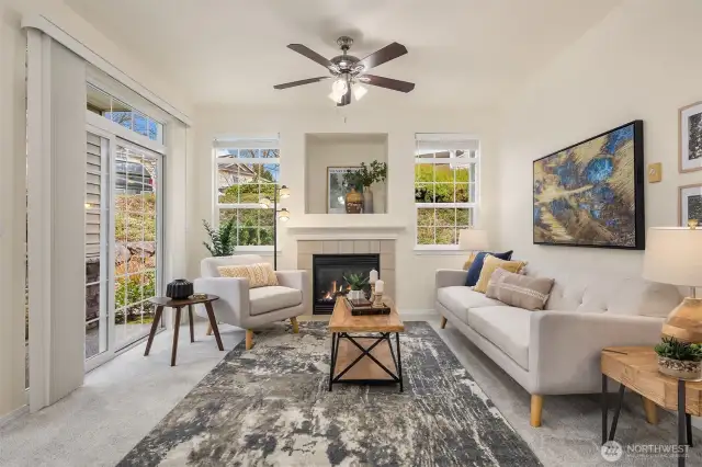 Full living room with slider door access to a covered, private patio.
