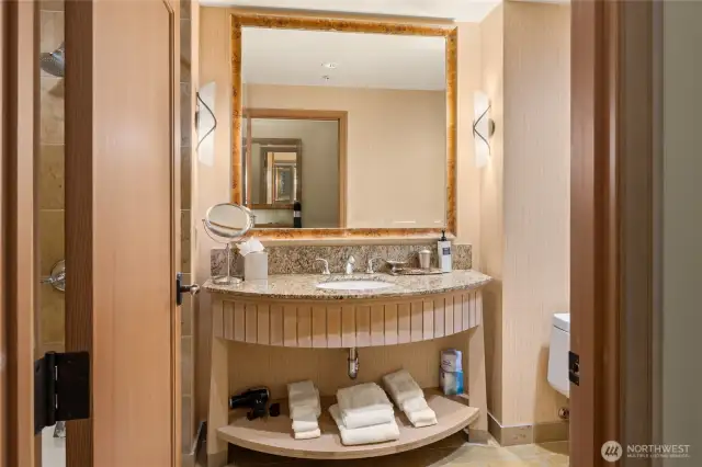 Vanity in bathroom with all the supplies.