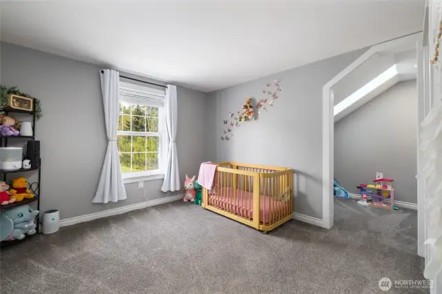 Bedroom #2.  To the right, note the extra nook space, perfect for a study nook or separate play area