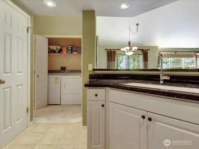 Pantry door on the left. Laundry straight ahead