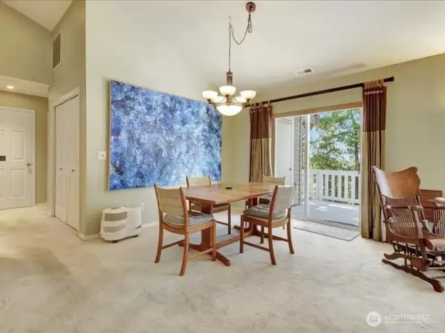 Large dining room with slider to deck