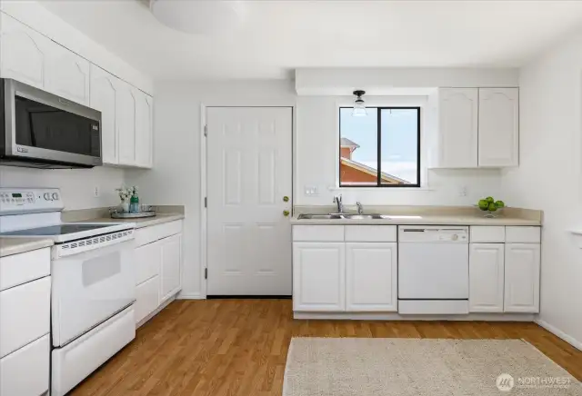 The door off kitchen leads to view deck.