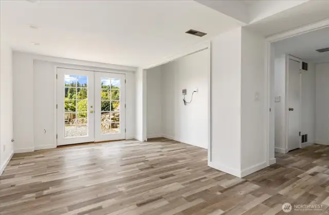 French doors open out to spacious yard.